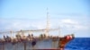 FILE - The Chinese squid fishing vessel Fu Yuan Yu 7880 sails on the Pacific Ocean on July 18, 2021. The Pingtan-affiliated vessel was arrested by South Africa in 2016 after it tried to flee a naval patrol that suspected it of illegal squid fishing. 