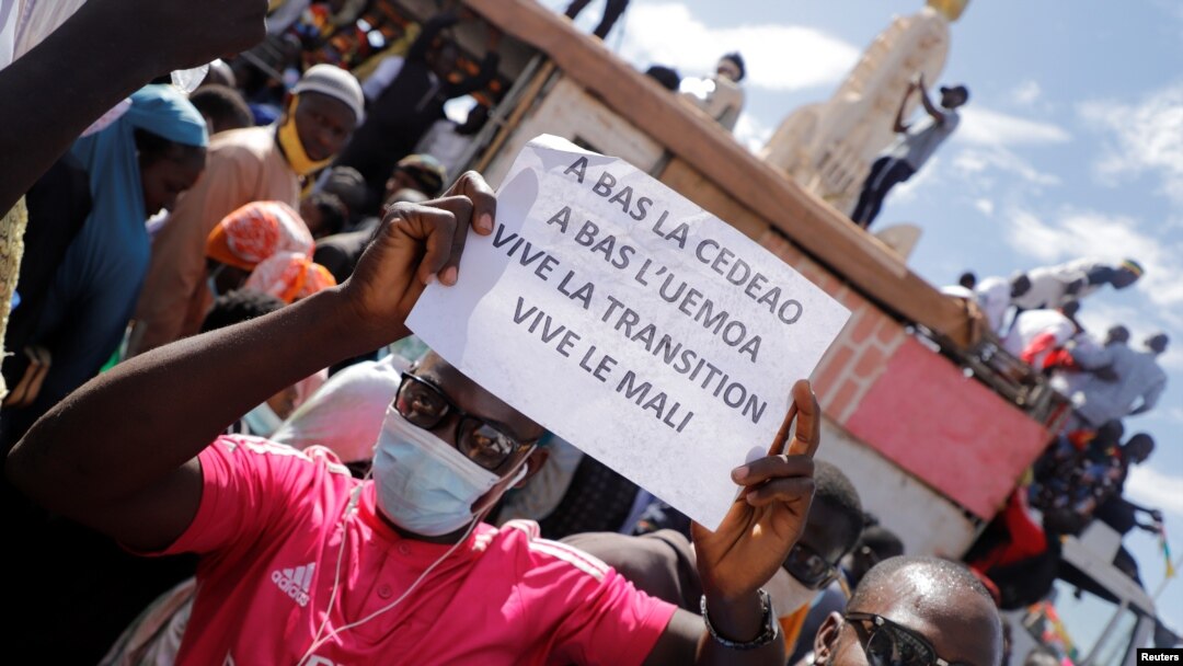 Supporters participate in a demonstration called by Mali's transitional government after ECOWAS (Economic Community of West African States) imposed sanctions in Bamako, Mali, Jan. 14, 2022. 