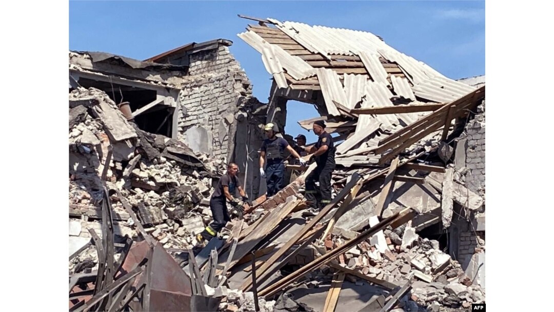 FILE - Rescuers removing debris after a military strike on Bakhmut, Donetsk region, amid Russia's military invasion launched on Ukraine, in this picture released by Ukrainian Emergency Service on Aug. 2, 2022.