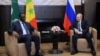 Russia's President Vladimir Putin (right) attends a meeting with Senegal's President Macky Sall, who is currently the chairman of the African Union, at the Bocharov Ruchei state residence in Sochi, Russia, June 3, 2022, in a Sputnik/Mikhail Klimentyev/Kremlin photo via Reuters. 