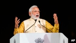 Indian Prime Minister Narendra Modi speaks at the inauguration of the revamped Central Vista Avenue at the India Gate in New Delhi, India, Sept. 8, 2022. 