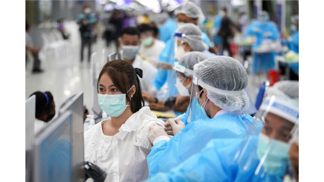 A person receives China's Sinovac coronavirus disease (COVID-19) vaccine at the Central Vaccination Center, inside the Bang Sue Grand Station, in Bangkok, Thailand, May 24, 2021. REUTERS
