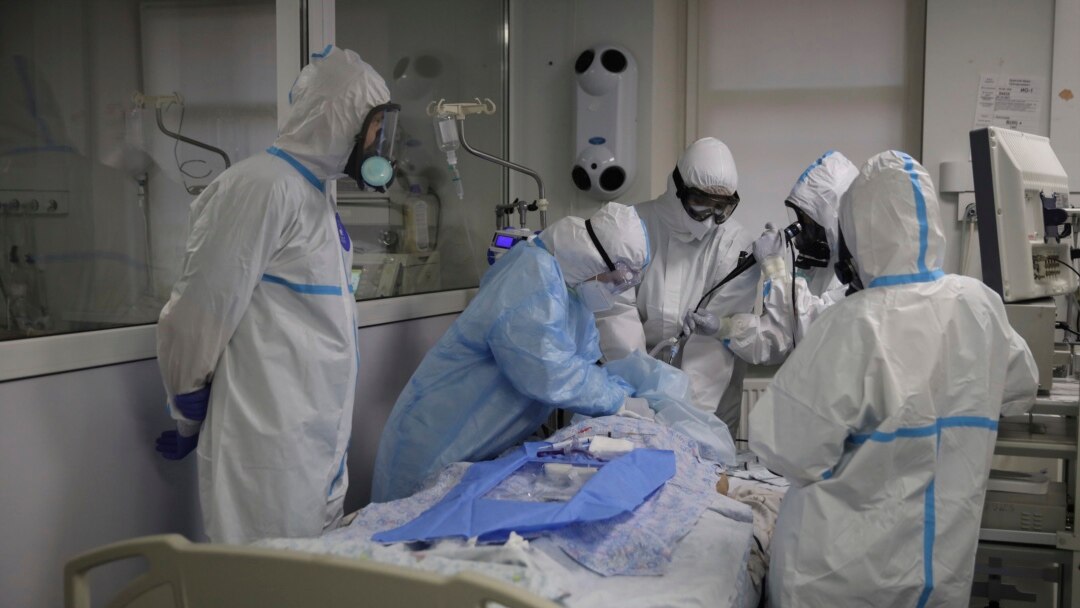 Medics treat a patient with coronavirus at an ICU at the Regional Clinical Hospital 1, in Krasnodar, south Russia, Nov. 2, 2021.