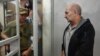 Volodymyr Tsemakh, an Ukrainian man suspected of involvement in the downing of flight MH17, is about to leave a dock of Kyiv court of appeal after the court verdict in Kyiv on Sept. 5, 2019.