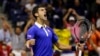 Novak Djokovic, of Serbia, reacts after breaking Roger Federer's serve to win a game in the fourth set during the men's championship match of the U.S. Open tennis tournament, Sunday, Sept. 13, 2015.