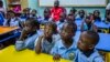 Refugee children at the African Hope School watch cartoons before they go home, Sept. 16, 2017, in Cairo, Egypt.