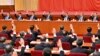 2021年11月11日，中共第19届中央委员会第六次全体会议上，政治局常委们举手表决。从左向右依次是韩正、王沪宁、栗战书、习近平、李克强、汪洋和赵乐际。照片由新华社发表，美联社提供。