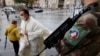 A French soldier stands guard in front of the cathedral in Cambrai during the All Saints Day mass, as the country has raised the security alert for its territory to the highest level after the knife attack in the city of Nice, Nov. 1, 2020.