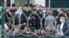 Lawyers, who were not allowed inside, wait outside the Sincan Penal Institutions Campus as the trials begin for pro-Kurdish Peoples' Democratic Party (HDP) members for their alleged roles in deadly 2014 protests on April 26, 2021.
