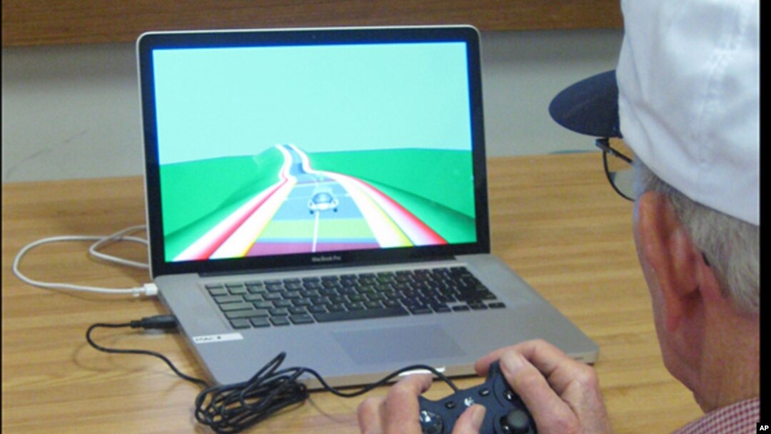 In this undated image provided by The Gazzaley Lab of the University of California, San Francisco, a study participant plays NeuroRacer in San Francisco. 