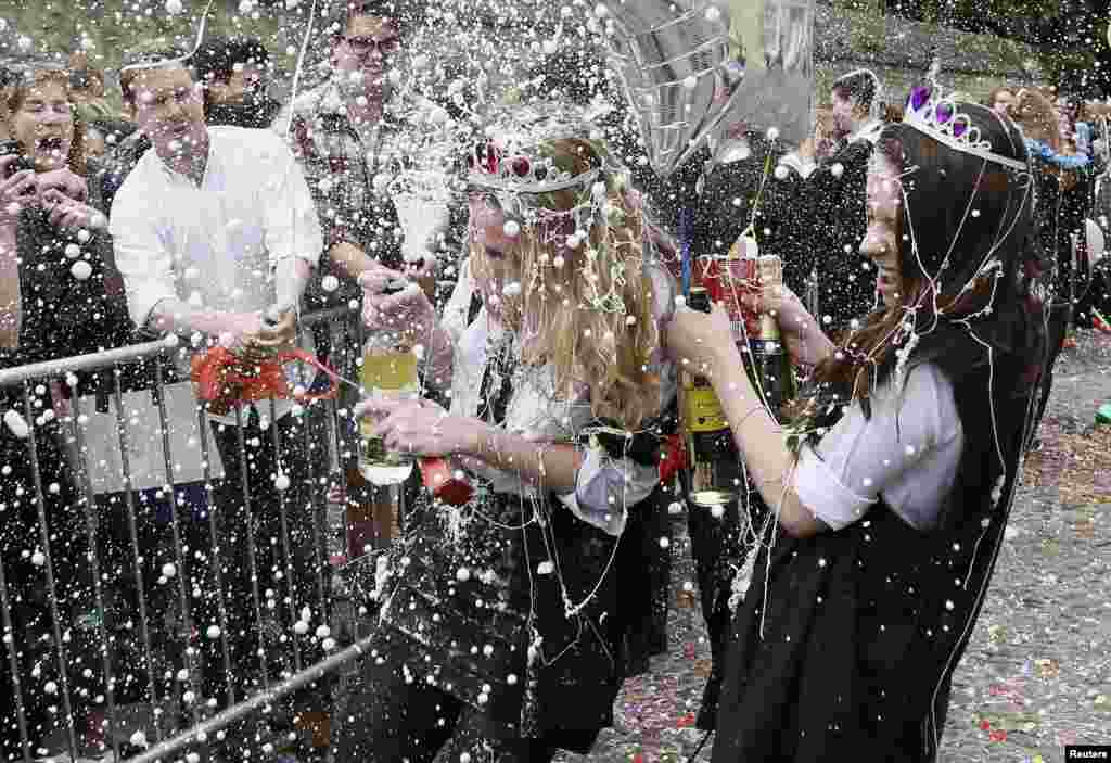Students from University College Oxford gets "trashed" after finishing their exams in Oxford, southern England. Trashing is a practice at Oxford University where students have messy items thrown at them by their contemporaries after finishing their exams.