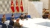 북한 관영매체가 지난달 21일에 이어 22일 노동당 중앙군사위원회 제8기 제3차 확대회의 현장이라고 공개한 사진. 앞 모습 왼쪽 세번째가 김정은 국무위원장. 한국 측 동해안 축선이 그려진 작전지도가 걸려있다.
