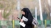 FILE - In this July 7, 2019, photo, Iran's telecommunications minister, Mohammad Javad Azari Jahromi, is interviewed by The Associated Press in Tehran. The U.S. Treasury on Nov. 22, 2019, sanctioned Jahromi over an internet shutdown in Iran.
