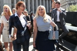 FILE - Virginia Giuffre, an alleged victim of Jeffrey Epstein, leaves after the hearing in the criminal case against Epstein, at Federal Court in New York, Aug. 27, 2019.
