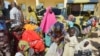 Women and children rescued by Nigerian soldiers from Boko Haram extremists in northeast Nigeria arrive at the military office in Maiduguri, Nigeria, July 30, 2015. 