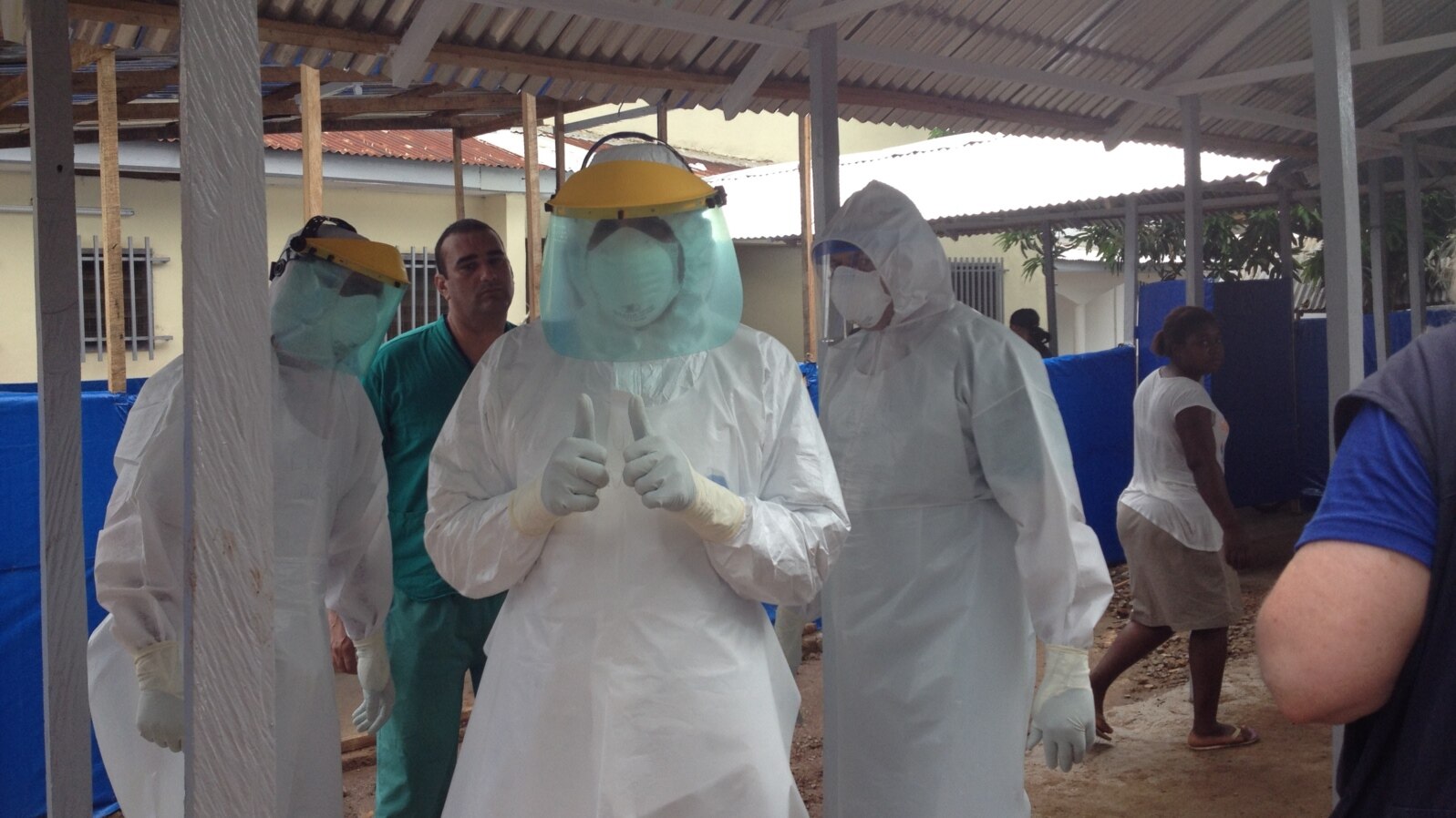 Cuban medical team training in personal protective equipment (PPE) at an Ebola center being built in Waterloo, east of Freetown, Sierra Leone, Nov. 17, 2014. (Nina deVries/VOA) 