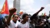 FILE - Eritrean refugees chant slogans as they participate in a demonstration in support of a U.N. human rights report accusing Eritrean leaders of crimes against humanity in front of the Africa Union headquarters in Ethiopia's capital, June 23, 2016.