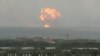 Flame and smoke rise from the site of blasts at an ammunition depot near the town of Achinsk in Krasnoyarsk region, Russia.