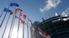 Flags of European Union member states fly in front of the European Parliament building in Strasbourg, France, April 15, 2014. 