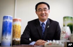FILE - Jian Yang, a New Zealand lawmaker who was born in China, speaks Jan. 26, 2016, in Auckland, New Zealand. Yang said in a statement Sept. 13, 2017, that he's loyal to his new home after media reported he'd spent a decade at top Chinese military colleges and was investigated by New Zealand's intelligence agency.