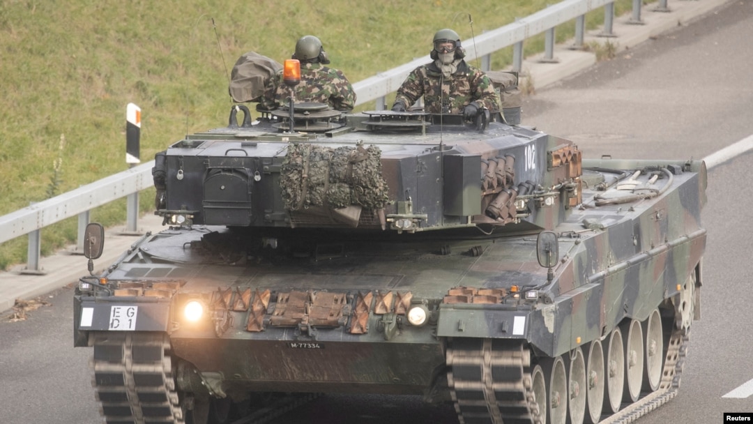 FILE - Soldiers of the Swiss Army are seen in a Leopard 2 tank, taking part in a military exercise near Othmarsingen, Switzerland Nov. 28, 2022. 