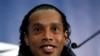 Brazilian national soccer team player Ronaldinho smiles during a news conference at Wembley stadium in London February 5, 2013. Brazil are set to play England in an international friendly soccer match on Wednesday. REUTERS/Stefan Wermuth (BRITAIN - Tags: