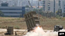 FILE - A missile is launched by an "Iron Dome" battery, a short-range missile defense system designed to intercept and destroy incoming short-range rockets and artillery shells. The senators say in their letter to the president they are currently considering increasing that Israeli missile defense funding in 2017. 