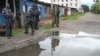 Burundian police and soldiers guard a deserted street in Bujumbura, Burundi, Nov. 8, 2015. 
