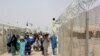 People arriving from Afghanistan make their way at the Friendship Gate crossing point at the Pakistan-Afghanistan border town of Chaman, Pakistan, Aug. 16, 2021. 