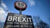 FILE - A Brexit sign is seen between Donegal in the Republic of Ireland and Londonderry in Northern Ireland at the border village of Muff, Ireland, Feb. 1, 2018.