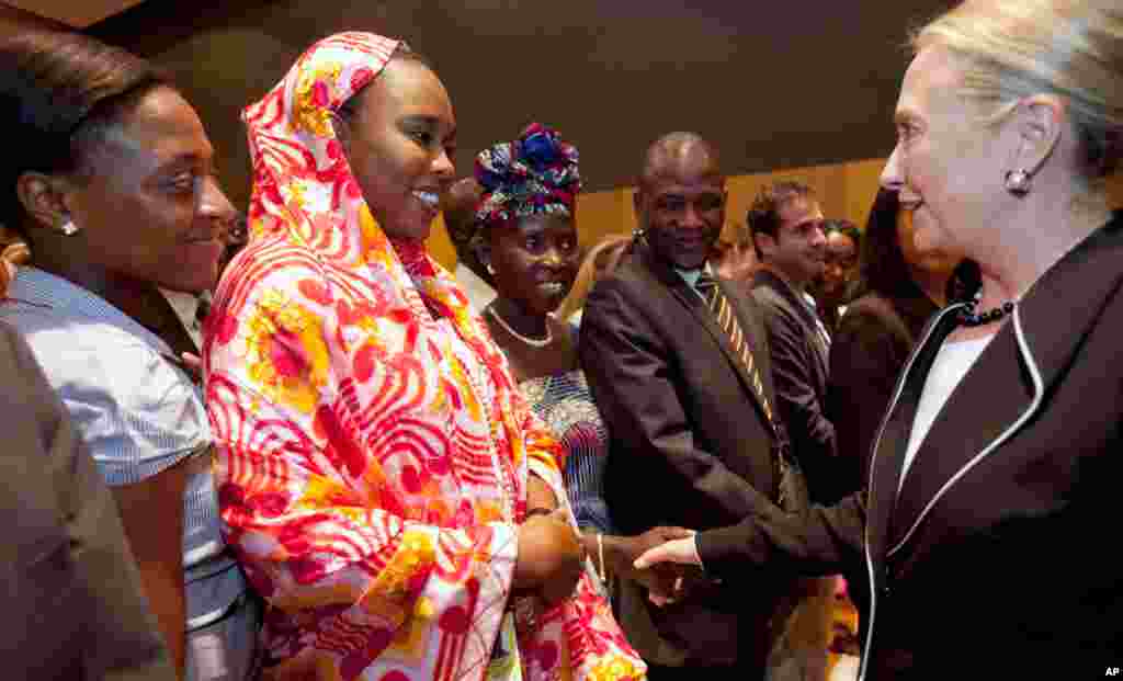 Hillary Clinton shakes hands with staff from the U.S. Embassy in Dakar, August 1, 2012.