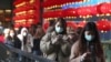 People wear face masks and walk at a shopping mall in Taipei, Taiwan, Jan. 31, 2020.