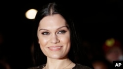 Jessie J poses for photographers upon arrival at the Mobo Awards, in central London, Oct. 22, 2014.