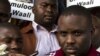FILE - Kampala Lord Mayor Erias Lukwago (R) address the media outside the Buganda Magistrates court, Uganda.
