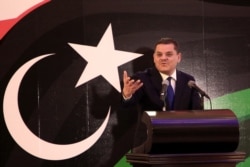 FILE - Libya's prime minister-designate Abdul Hamid Dheibah speaks during a press conference in the capital, Tripoli, Feb. 25, 2021.