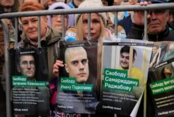 People attend a rally to demand the release of jailed protesters, who were detained during opposition demonstrations for fair elections, in Moscow, Sept. 29, 2019.