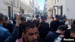 Police block the roads as former Prime Minister Ahmed Ouyahia appears in court in Algiers, Algeria, April 30, 2019. 