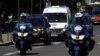A police convoy believed to be carrying Rwandan genocide fugitive Felicien Kabuga arrives at the Paris courthouse where Kabuga is due to appear for an arraignment hearing, France, May 19, 2020.