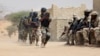 FILE- Nigerian special forces and Chadian troops participate with U.S. advisers in the Flintlock exercise in Mao, Chad, March 7, 2015. This year's just-begun Flintlock exercise, designed to strengthen security partnerships and train elite counterterrorism units in the Sahel region, is being held in Agadez, Niger.