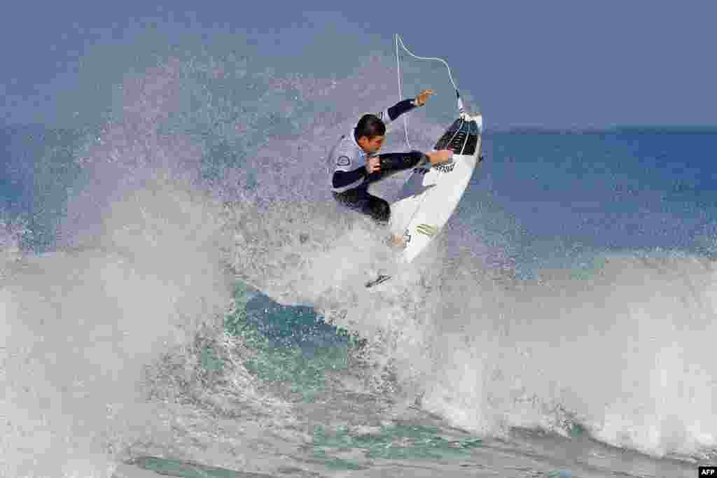 Surfer Luis Diaz of the Canary Island rides a wave during the Men&#39;s QS 3,000 of the World Surf League SEAT Pro Netanya qualification, in the Israeli coastal city of Netanya.