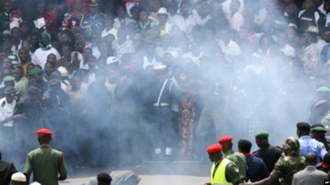 A Nigerian soldier lies on the ground after a small blast was heard in the midst of 50th anniversary celebrations of Nigeria's independence at Eagle Square in Abuja, Nigeria, 01 Oct 2010
