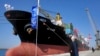 FILE - Hassan Rouhani, who was president of Iran in 2017, poses during the inauguration a newly built extension of the port of Chabahar, near the Pakistani border, on the Gulf of Oman, southeastern Iran, Dec. 3, 2017. 