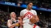 Džontej Porter tokom meča protiv Denver Nagetsa Nikole Jokića (AP/David Zalubowski)