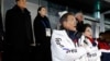South Korean President Moon Jae-in, stands alongside first lady Kim Jung-sook as the South Korean national anthem is played at the opening ceremony of the 2018 Winter Olympics in Pyeongchang, South Korea, Feb. 9, 2018.