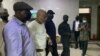 The Nigeria State Secret Police escort separatist leader Nnamdi Kanu, second from left, outside the Federal High Court in Abuja, Nigeria, Oct. 21, 2021. 
