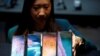 FILE - A Samsung employee arranges the new Samsung Galaxy S10e, S10, S10+ and the Samsung Galaxy S10 5G smartphones at a press event in London, Britain Feb. 20, 2019.