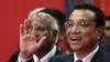 Chinese Premier Li Keqiang gestures as he speaks during his visit to the Tata Consultancy Services office in Mumbai, India, May 21, 2013. 