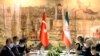 FILE - A Turkish delegation, left, meets with Iranian counterparts to discuss bilateral issues and Syria, June 15, 2020, in Istanbul. 