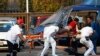 Paramedics wheel an injured person to a helicopter at the parking lot of the state-run oil company Pemex after an explosion in Mexico City, January 31, 2013.