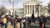 Washington D.C.-area high school students protesting President-elect Donald Trump marched from the Trump International Hotel to the U.S. Supreme Court, Nov. 15, 2016. (E. Sarai/VOA)